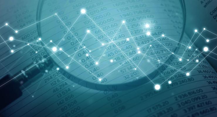 Magnifying glass examining data